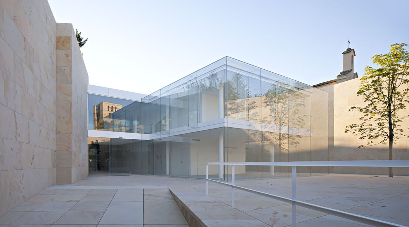 Architecture enclosed within stone and glass. The building seems to be  floating in the air - designonweb - arkitectureonweb