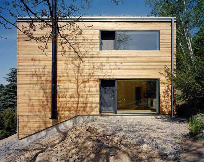 Summer villa outside Prague. Larch cladding for a solidly shaped wooden house