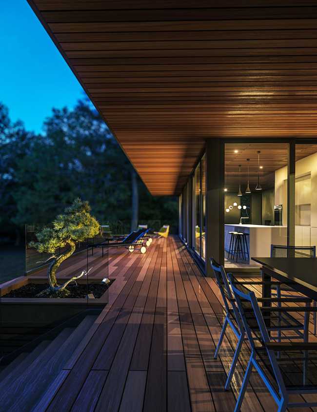 Housing on the shores of a lake. Horizontal structure in a picturesque natural landscape