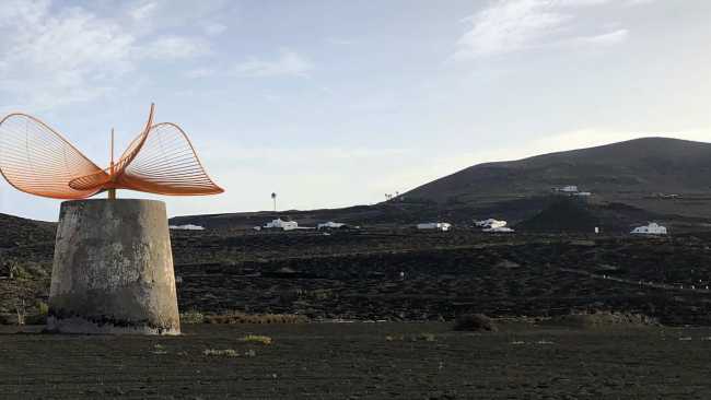 Among the volcanoes of Lanzarote, a windmill-turbine combination of poetry and technology