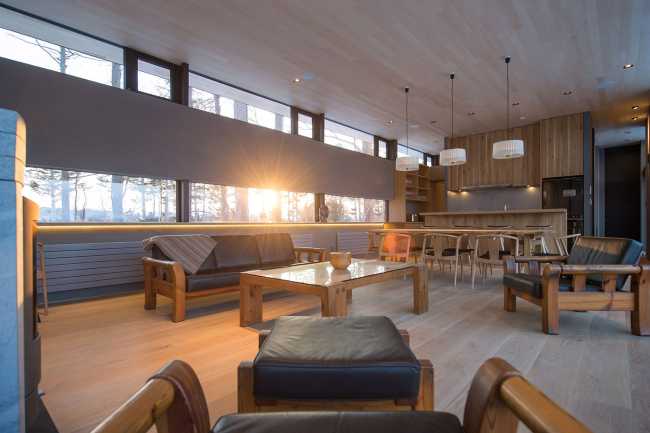 Architectural dialogue between cedar and metal for the Hiyoku house, set against the backdrop of the snow-capped mountains of Japan.