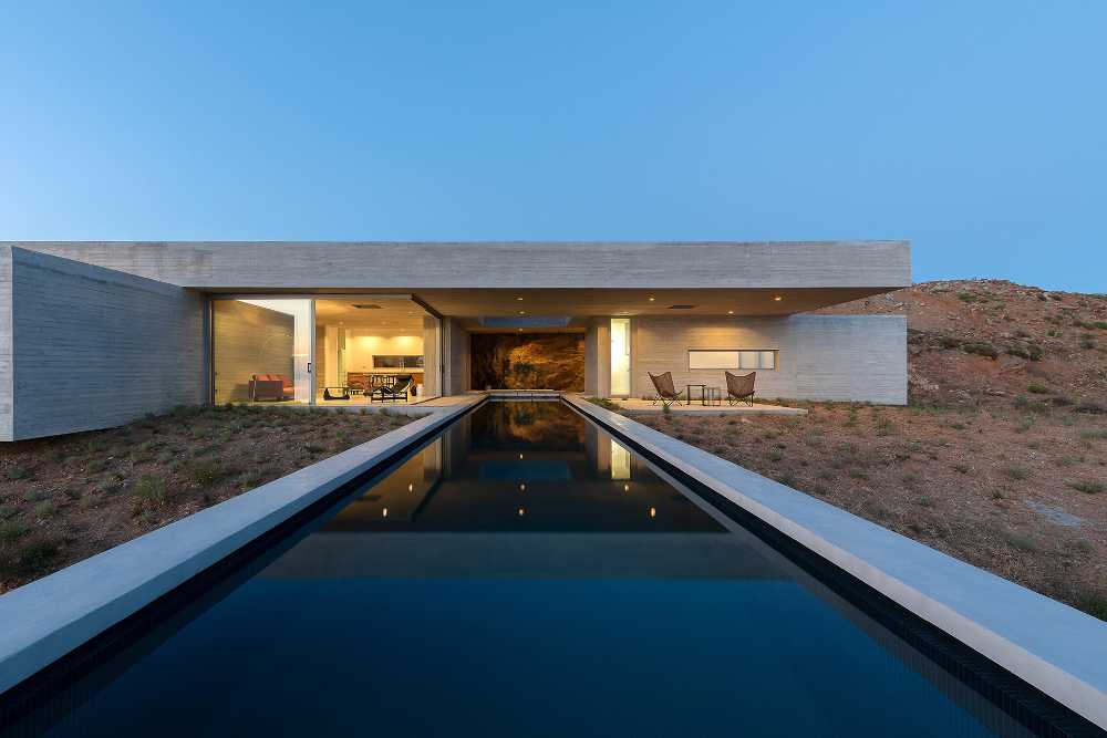 Lap Pool House: an artificial cave carved into the natural landscape of a Greek island