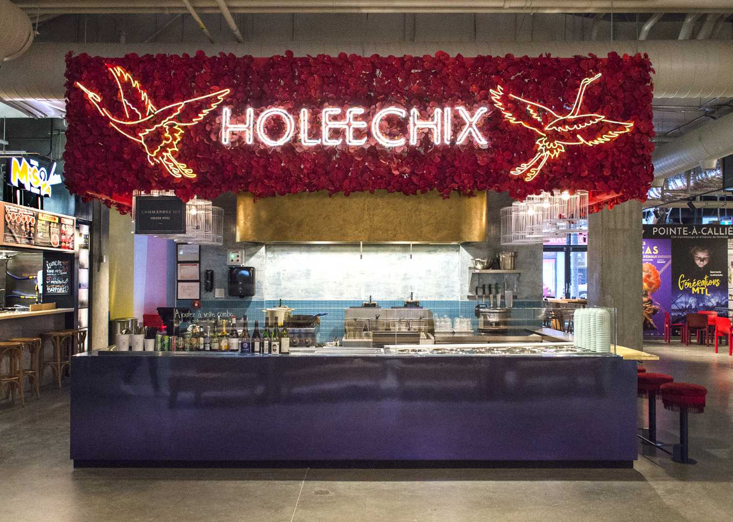 Ho Lee Chix. Red flowers and crane-shaped neon for a street food stall