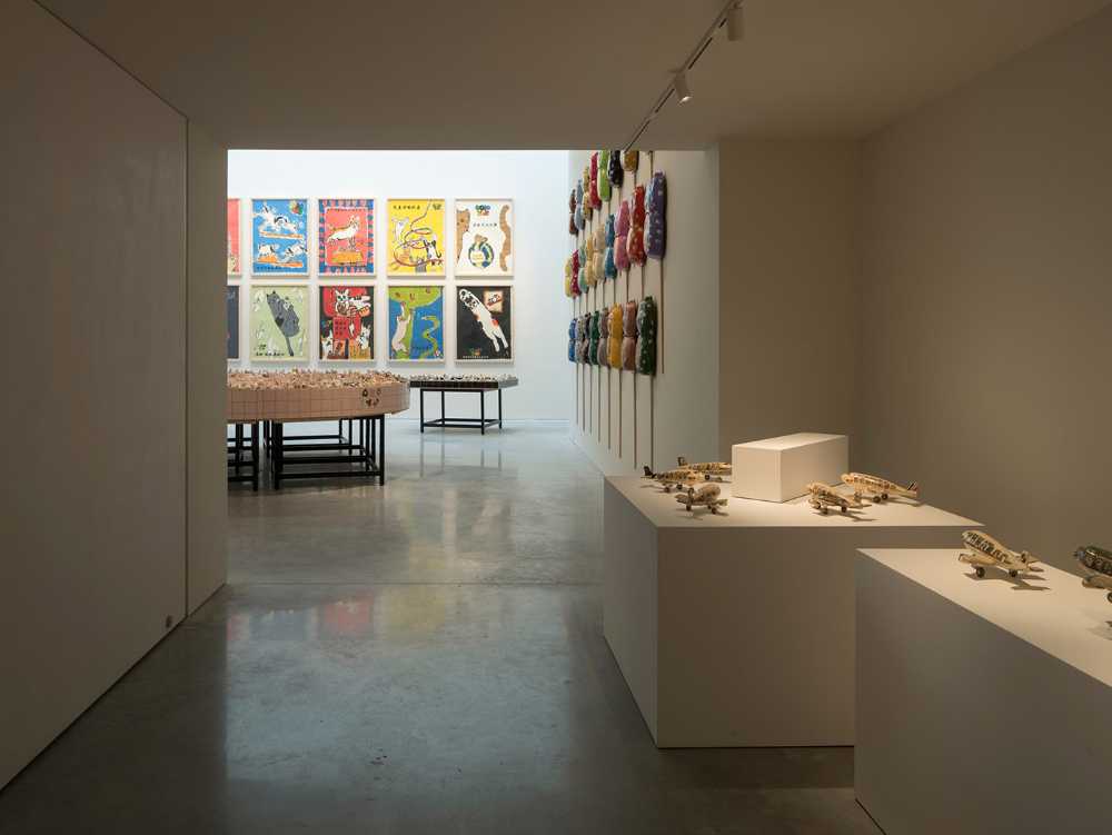 Purity of volume, natural light and traditional materials blend in the design of the new OTA FINE ARTS gallery