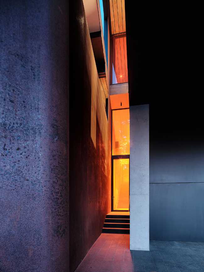 A minimal palette of materials: wood, concrete, and steel define the spaces of Lookout House.