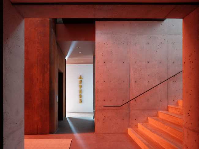 A minimal palette of materials: wood, concrete, and steel define the spaces of Lookout House.