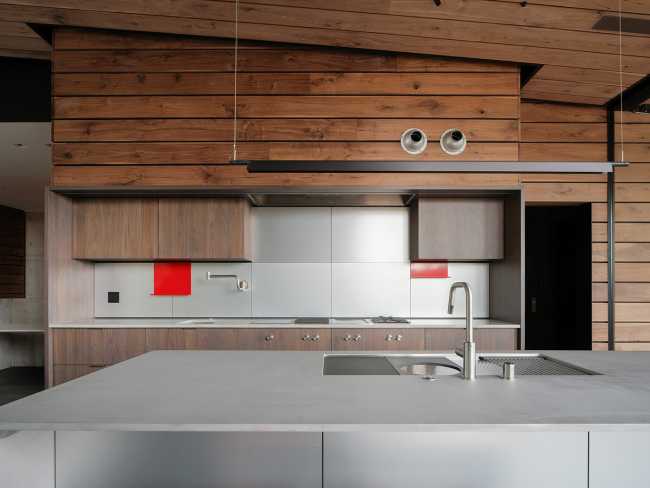 A minimal palette of materials: wood, concrete, and steel define the spaces of Lookout House.