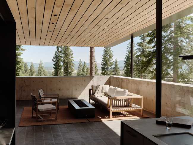 A minimal palette of materials: wood, concrete, and steel define the spaces of Lookout House.