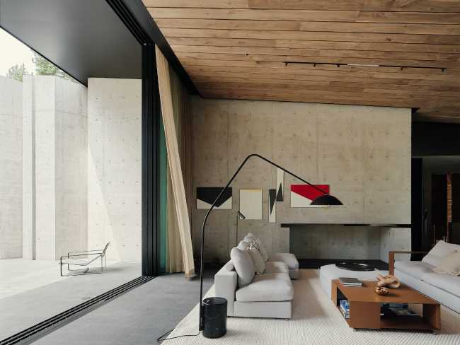 A minimal palette of materials: wood, concrete, and steel define the spaces of Lookout House.