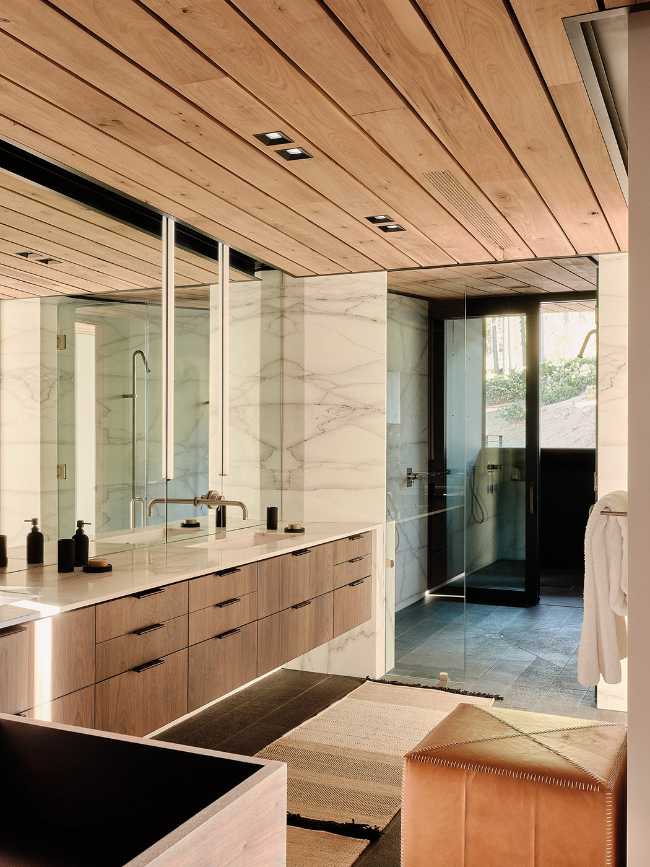 A minimal palette of materials: wood, concrete, and steel define the spaces of Lookout House.