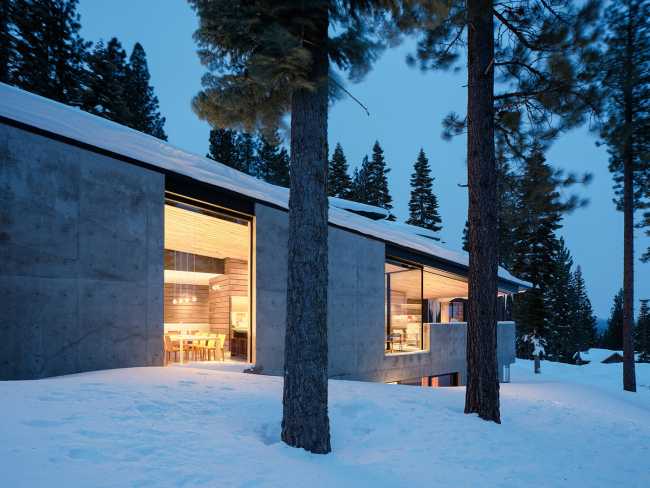 A minimal palette of materials: wood, concrete, and steel define the spaces of Lookout House.