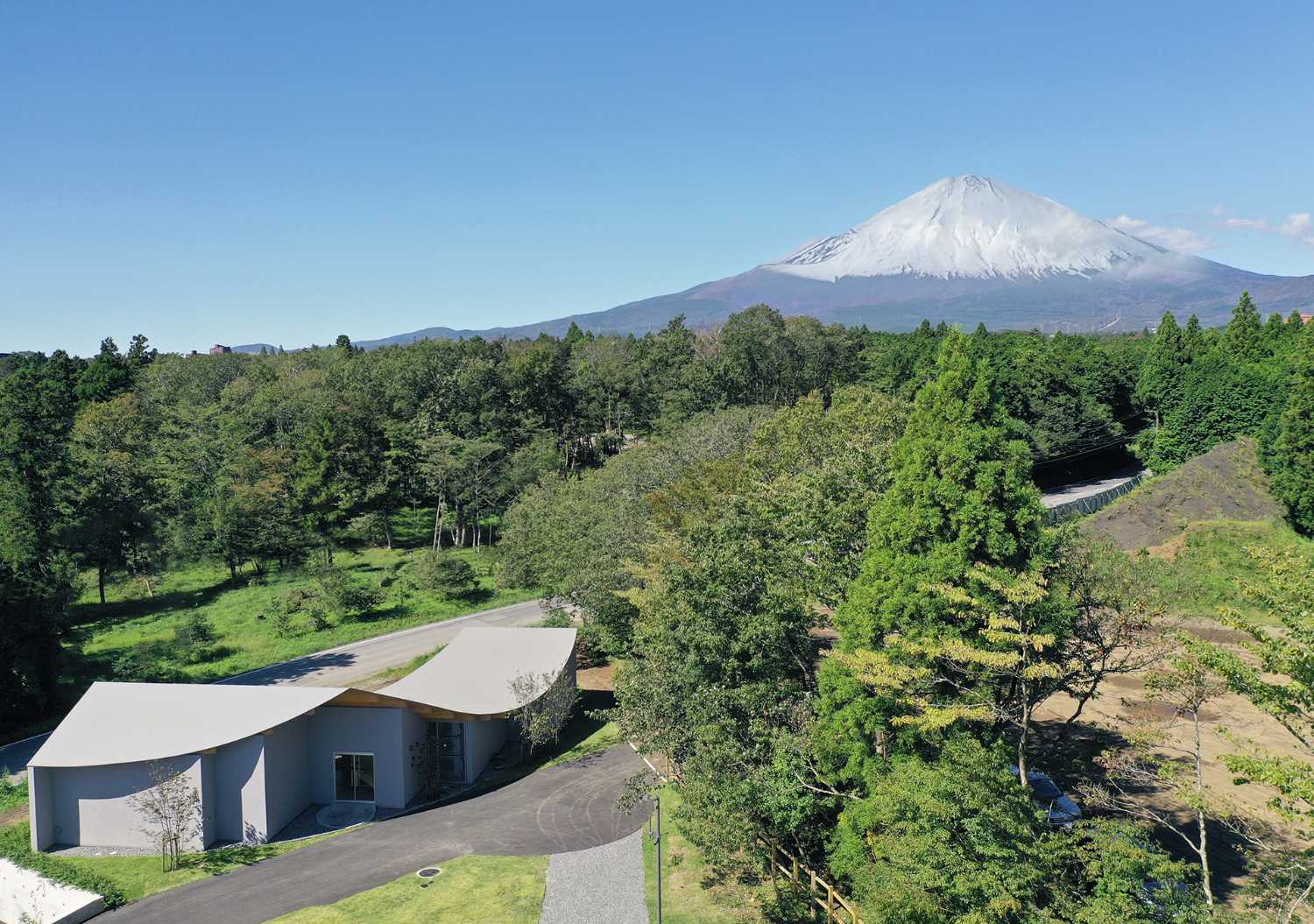 The hotel nestled at the foot of the hill which runs toward Mount Fuji