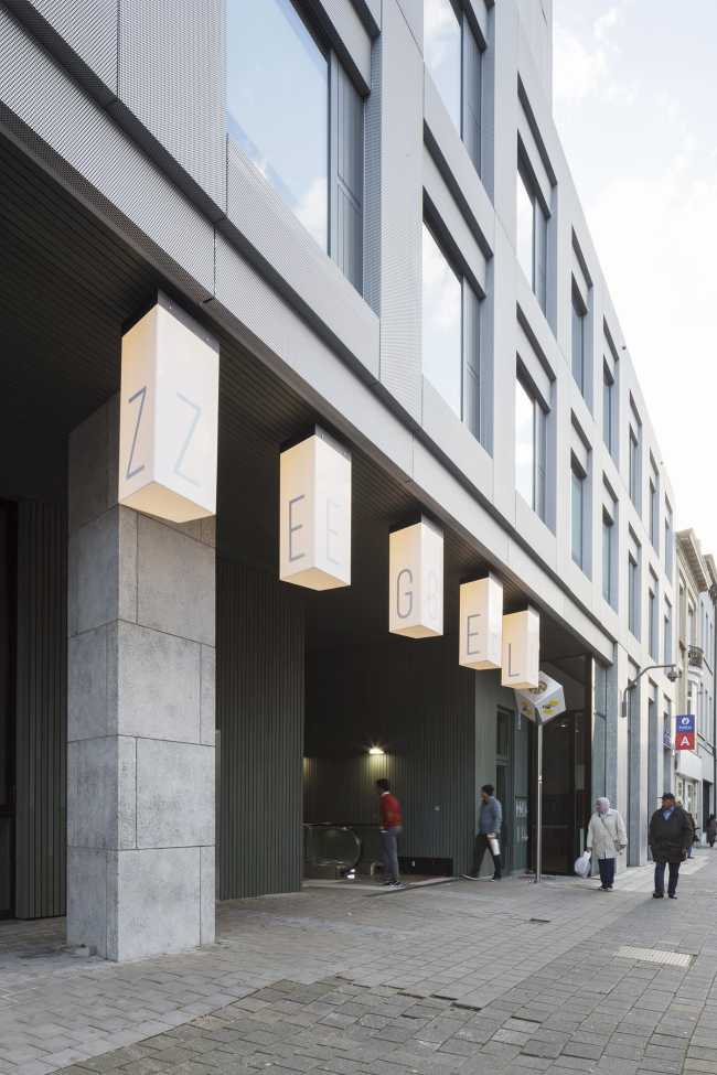 Zegel a mixed-function building with an exuberant structure toned down by the lightweight aluminum façade shell