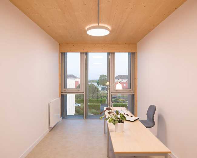 The ASSIA headquarters extension. Building structure in wood, concrete and glass