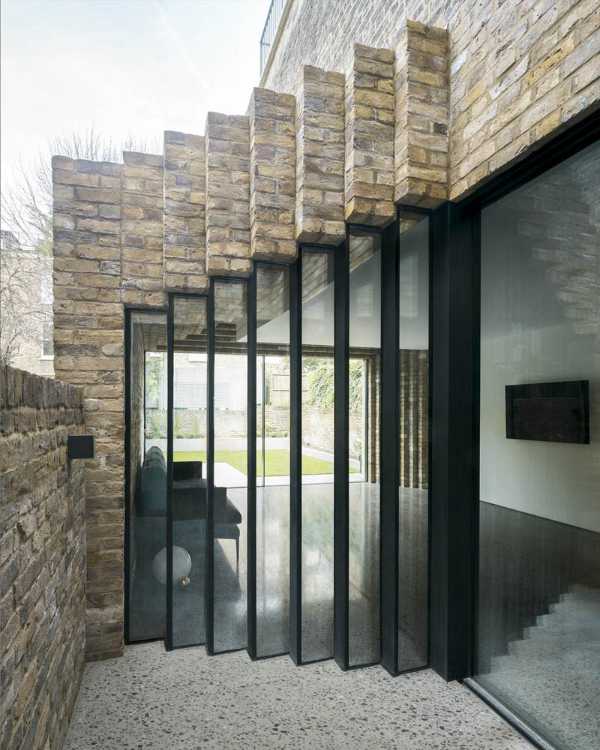 glass detail with black fixtures and bricks