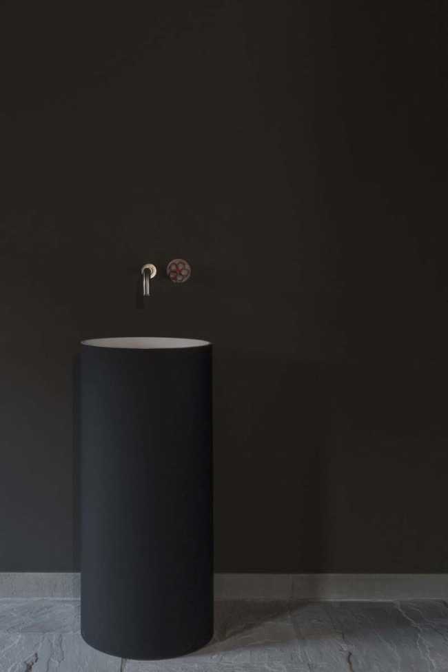 In the bathroom dark tones for the sink from the ground