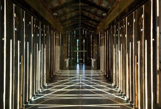 The light filters through the entrance corridor creating a play of lights