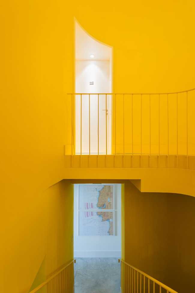 paths and yellow stairwell walls