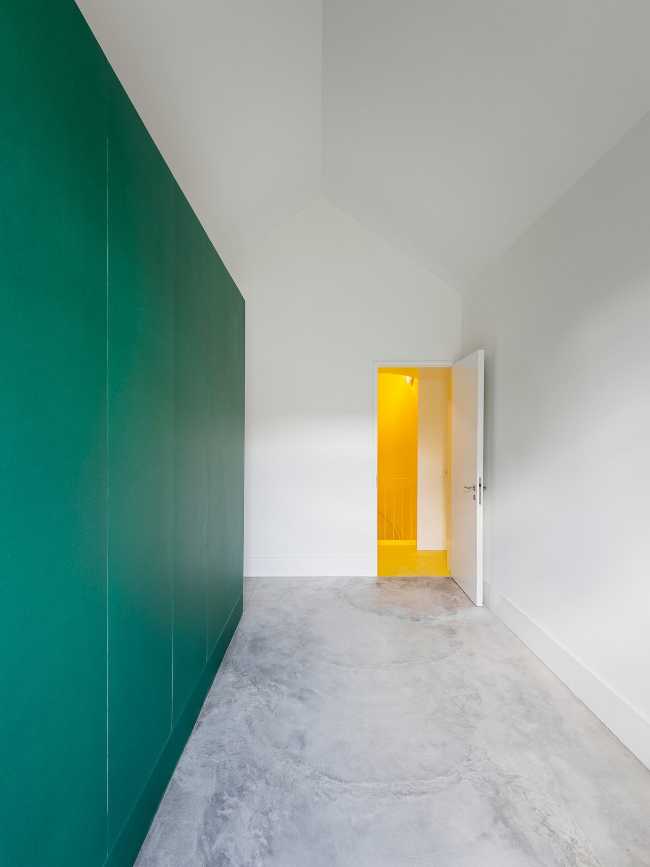 In the bedroom and wall of the green bathroom
