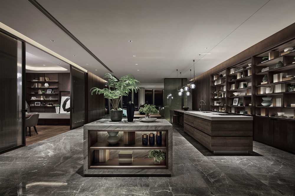 The large kitchen with exposed shelves and stone floor