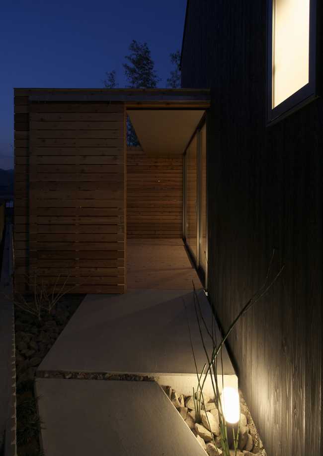 Wooden house and outdoor lighting