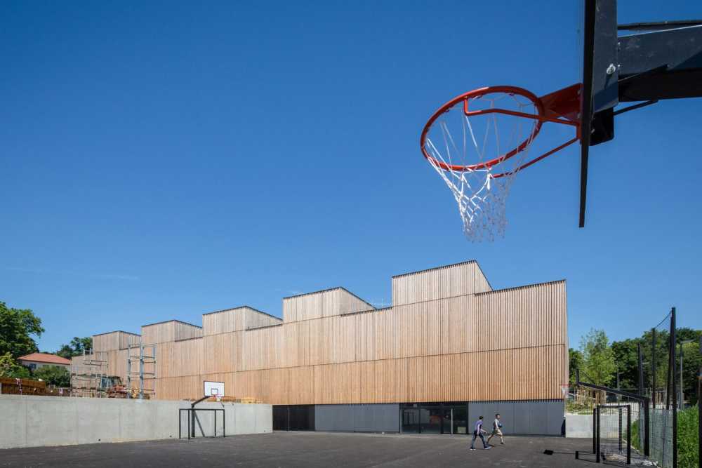 Hacine Cherifi Sports Center: wooden gyms serving schools and the neighborhood
