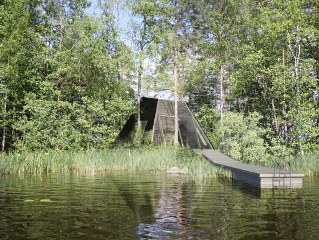 Wooden house with walkway near the lake