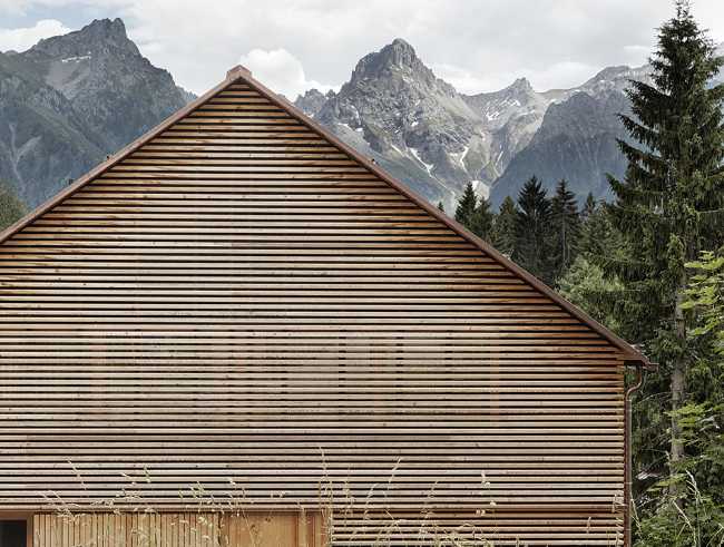 House with wooden slats with traditional shapes
