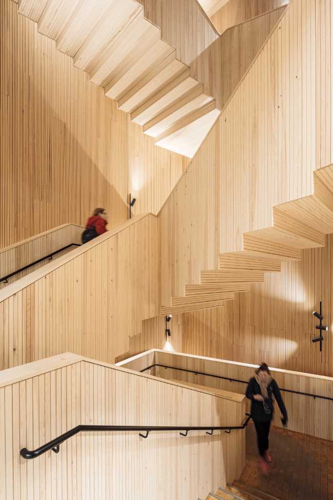 Wooden staircase body with metal balustrade