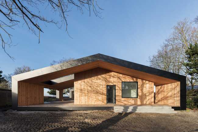 Wooden holiday home with traditional shapes