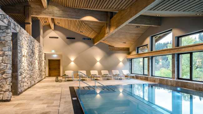 Relax area with wooden and stone pool for a luxury resort