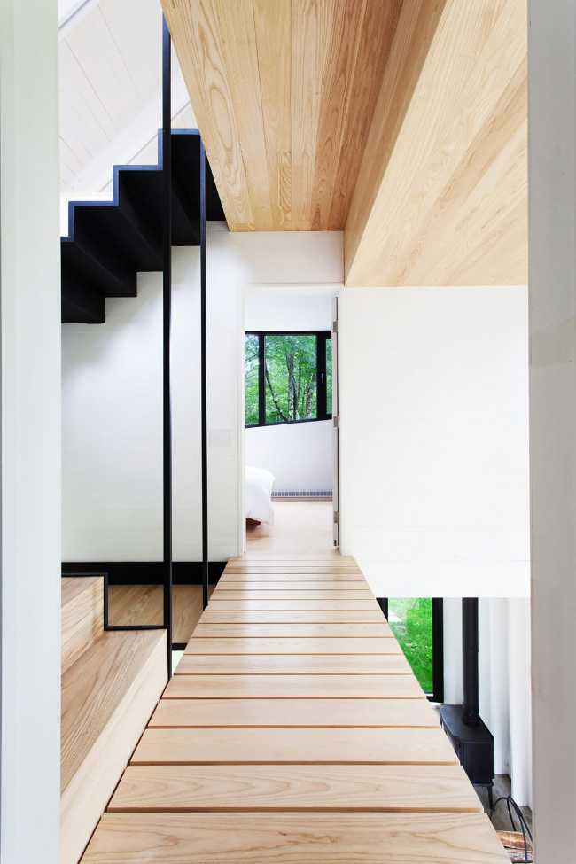 white wooden interior with metal staircase