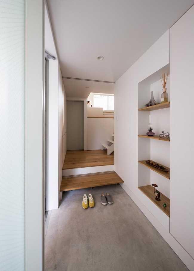 Corridor with white with wooden floors