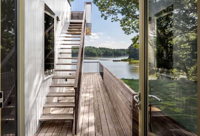 External wooden staircase next to the house