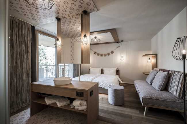 bedroom with sofa and sink