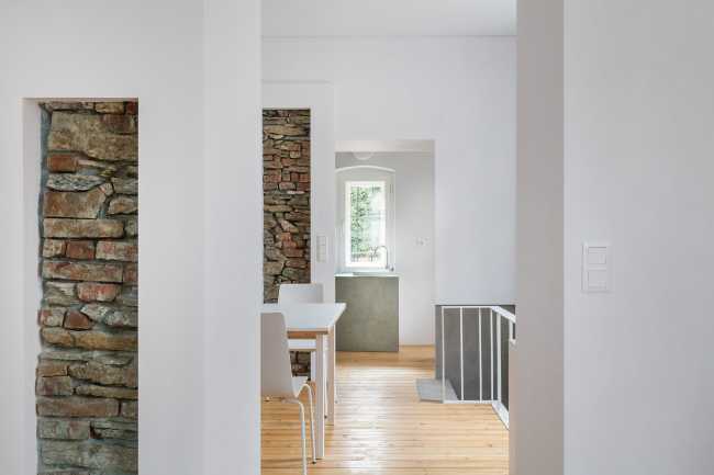 Stone and white wall with parquet