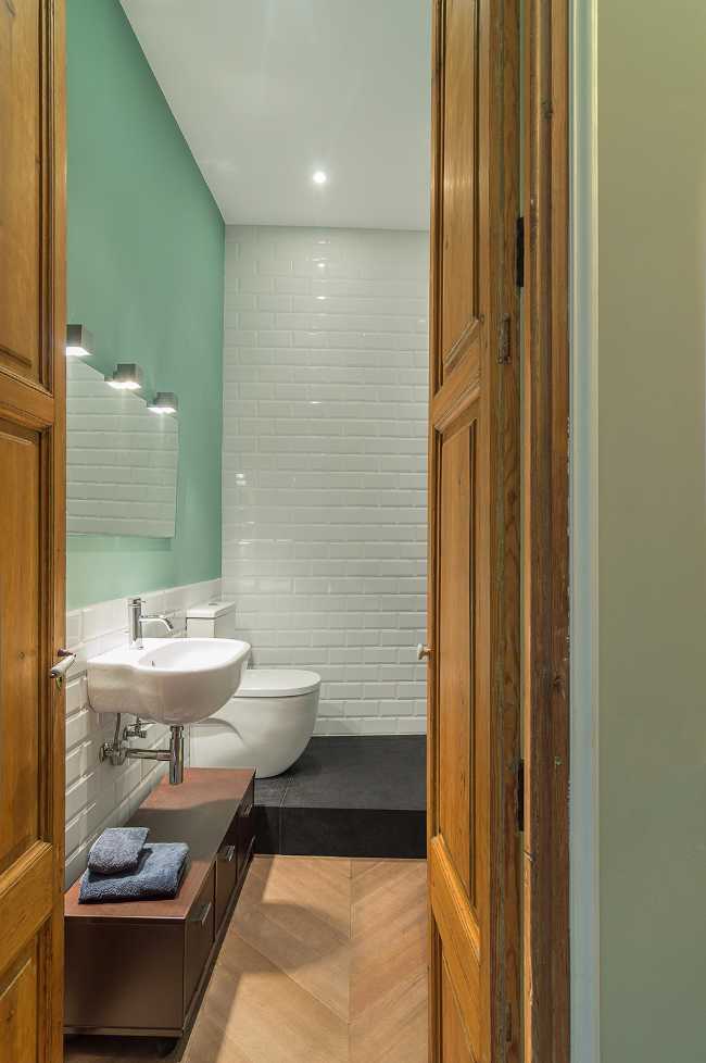 bathroom with parquet and white tiles
