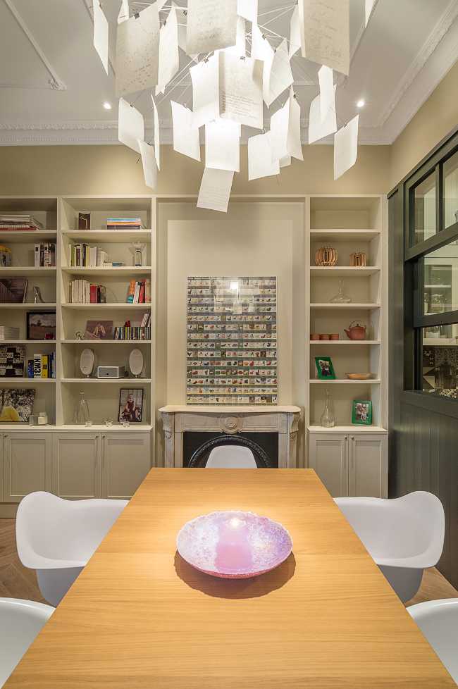 living room with wooden table and white chairs