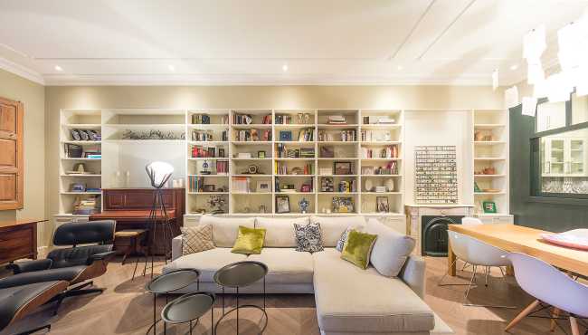 living room with bookcase wall