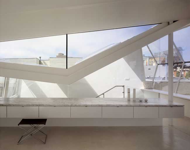 minimalist living area glass walls