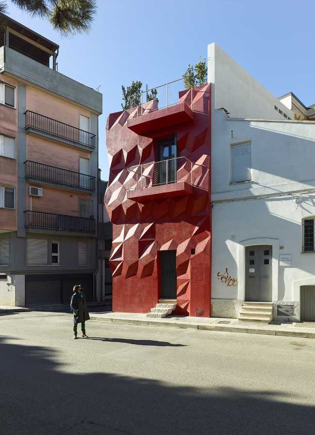 modernist facade red urban insertion