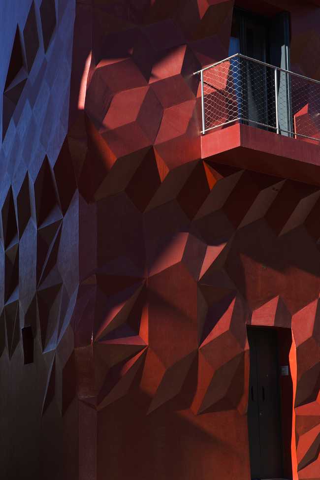 modernist red facade overhanging geometries