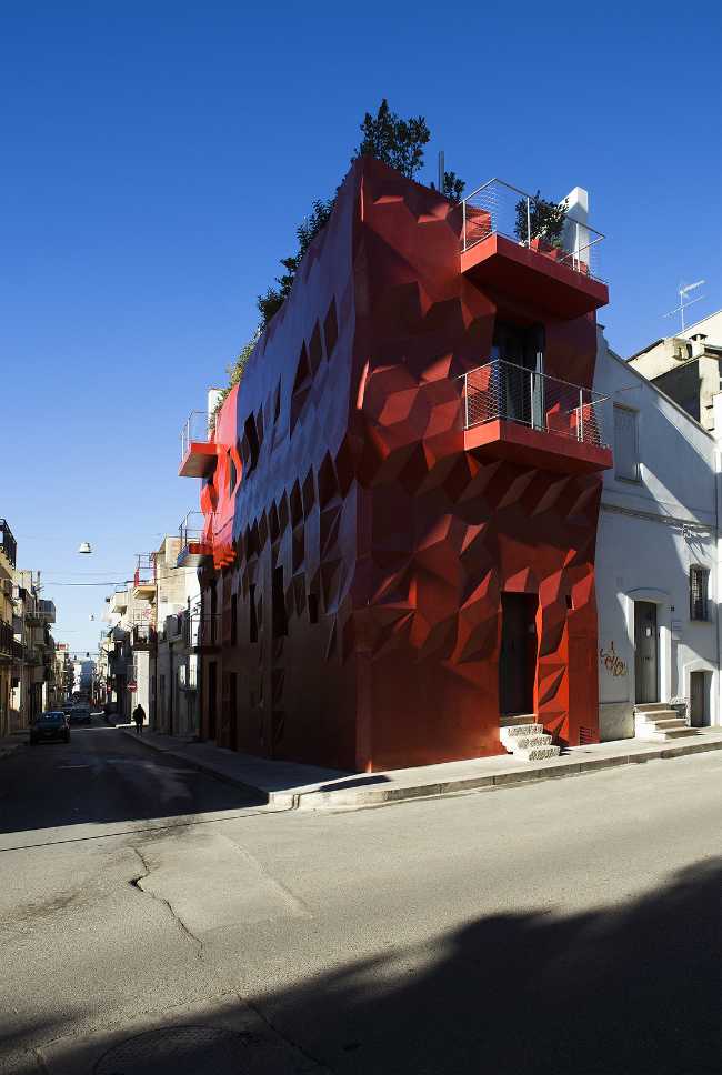 red modernist corner facade