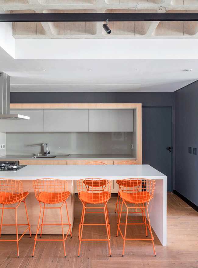Kitchen with orange stools