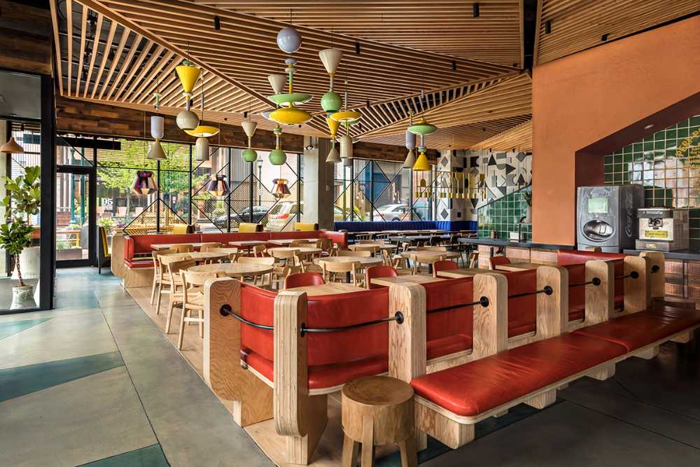 Restaurant with colorful and wooden interior