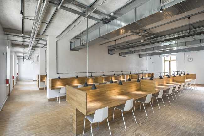 ex caserma Paris library furniture wood beams metal view