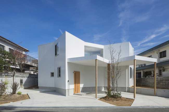 White wooden house with complex geometries