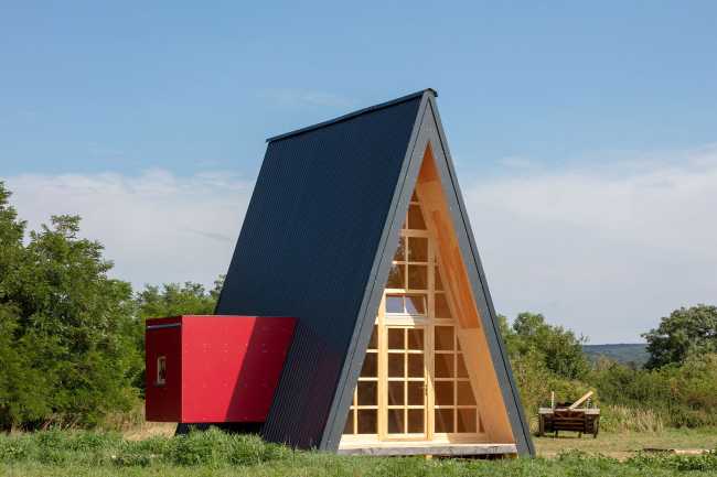 Wooden cabin with triangular shape