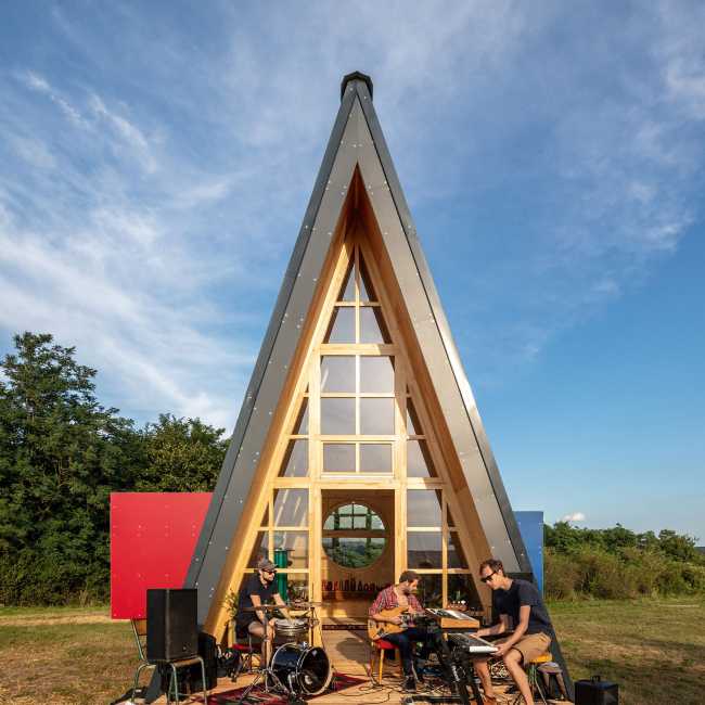 Wooden cabin with triangular shape