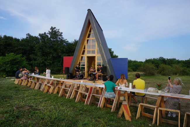 Wooden cabin with triangular shape